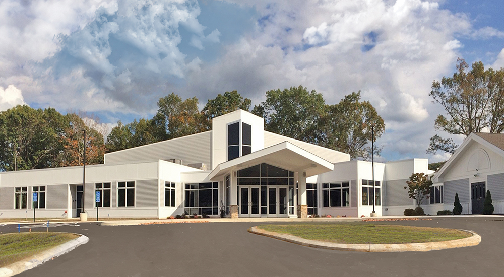 View of white color building with glasses on display